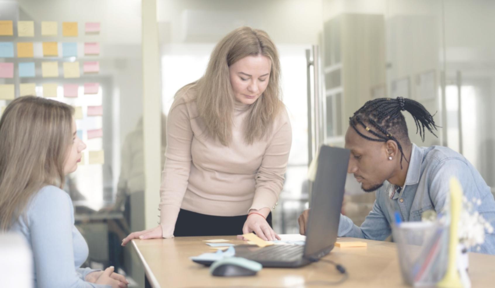 Creative professionals learning financial concepts in modern workspace