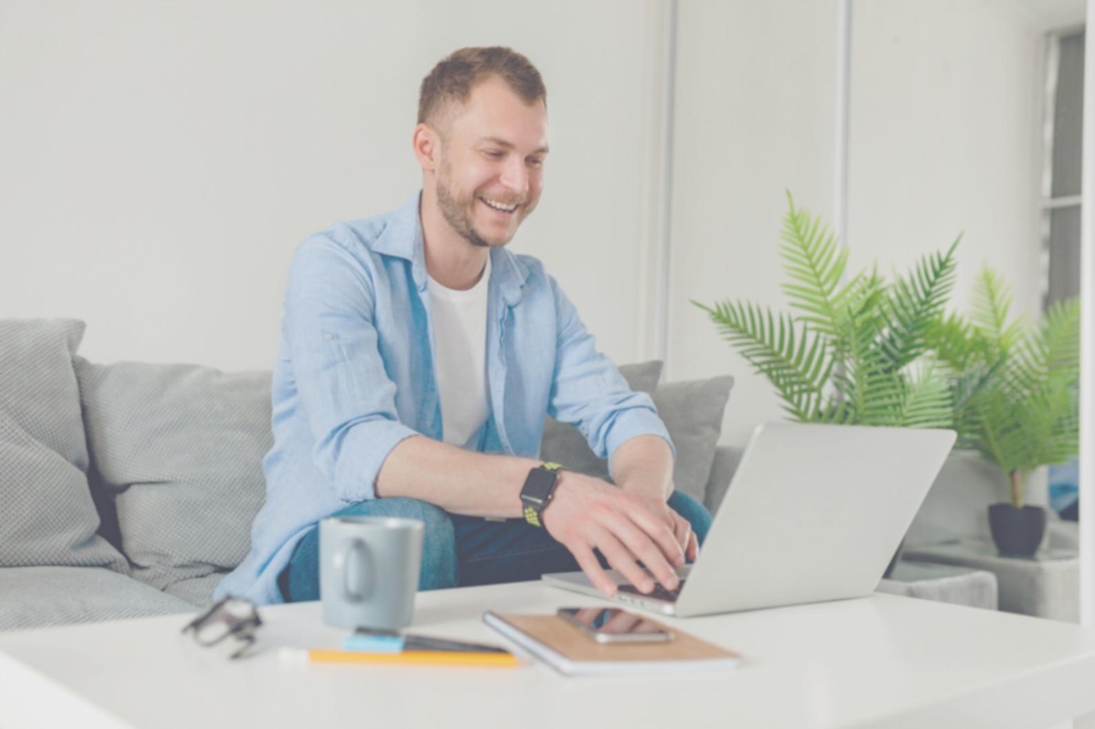 Creative entrepreneur reviewing financial reports on laptop